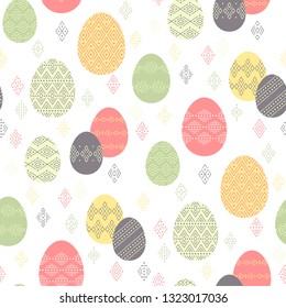 Color easter eggs with ethnic ornament  on white background. Abstract seamless pattern for Easter design and decoration
