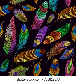 Color feathers embroidery seamless pattern. Fashionable template for design of clothes, t-shirt design. Beautiful feathers of tropical birds classic embroidery seamless background 