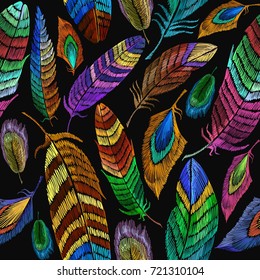 Color feathers embroidery seamless pattern. Fashionable template for design of clothes, t-shirt design. Beautiful feathers of tropical birds fashion embroidery seamless background 