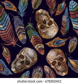 Color feathers and indian skull embroidery seamless pattern. Beautiful feathers of tropical birds and human skull classic embroidery seamless pattern 