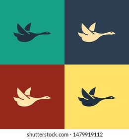 Color Flying duck icon isolated on color background. Vintage style drawing. Vector Illustration