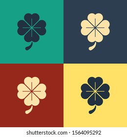 Color Four leaf clover icon isolated on color background. Happy Saint Patrick day. Vintage style drawing. Vector Illustration