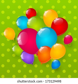 Color glossy balloons on green