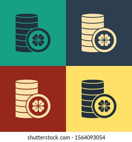 Color Gold coin with four leaf clover icon isolated on color background. Happy Saint Patricks day. Vintage style drawing. Vector Illustration