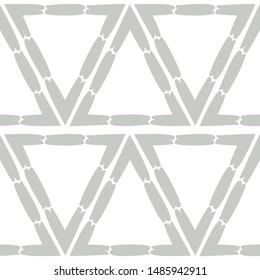 Color - gray and white. Ethnic boho seamless pattern. Lace. Embroidery on fabric. Patchwork texture. Weaving. Traditional ornament. Tribal pattern. Can be used for wallpaper, textile, wrapping, web. 