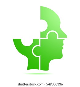 The color green human head composed of red puzzle pieces with gray shadow below the head on a white background. Incomplete human head composed of geometric elements 