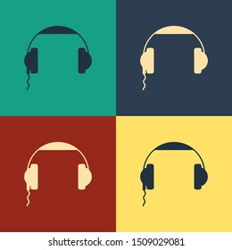 Color Headphones icon isolated on color background. Earphones sign. Concept for listening to music, service, communication and operator. Vintage style drawing. Vector Illustration