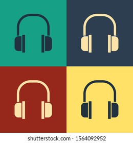 Color Headphones icon isolated on color background. Earphones sign. Concept for listening to music, service, communication and operator. Vintage style drawing. Vector Illustration