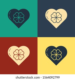 Color Heart with four leaf clover icon isolated on color background. Happy Saint Patrick day. Vintage style drawing. Vector Illustration