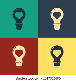 Color Heart shape in a light bulb icon isolated on color background. Love symbol. Valentine day symbol. Vintage style drawing. Vector Illustration