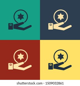 Color Jewish coin on hand icon isolated on color background. Currency symbol. Vintage style drawing. Vector Illustration