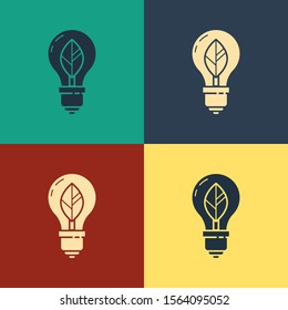 Color Light bulb with leaf icon isolated on color background. Eco energy concept. Alternative energy concept. Vintage style drawing. Vector Illustration