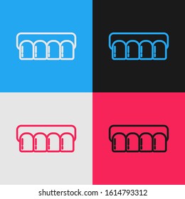 Color line Dentures model icon isolated on color background. Teeth of the upper jaw. Dental concept. Vintage style drawing. Vector Illustration