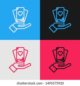 Color line Hand holding playing cards icon isolated on color background. Casino game design. Vintage style drawing. Vector Illustration