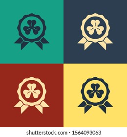 Color Medal with four leaf clover icon isolated on color background. Happy Saint Patrick day. Vintage style drawing. Vector Illustration