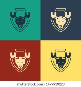 Color Moose head on shield icon isolated on color background. Hunting trophy on wall. Vintage style drawing. Vector Illustration