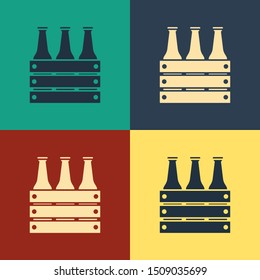 Color Pack of beer bottles icon isolated on color background. Wooden box and beer bottles. Case crate beer box sign. Vintage style drawing. Vector Illustration