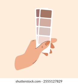 Color palette choice. Hand holds palette with the trending color of 2025. Color of chocolate mousse and mocha. Cards with brown colors for fashion shows, demonstration of trends in clothing.