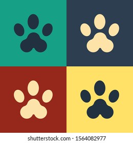 Color Paw print icon isolated on color background. Dog or cat paw print. Animal track. Vintage style drawing. Vector Illustration