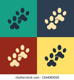 Color Paw print icon isolated on color background. Dog or cat paw print. Animal track. Vintage style drawing. Vector Illustration