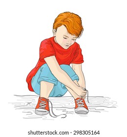 a color picture of a little boy tying his shoelaces