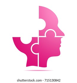 The color pink human head composed of pink puzzle pieces with gray shadow below the head on a white background. Incomplete human head composed of geometric elements 