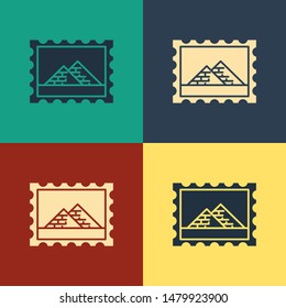 Color Postal stamp and Egypt pyramids icon isolated on color background. Vintage style drawing. Vector Illustration
