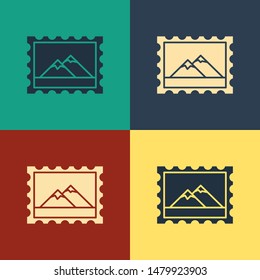 Color Postal stamp and Mountains icon isolated on color background. Vintage style drawing. Vector Illustration