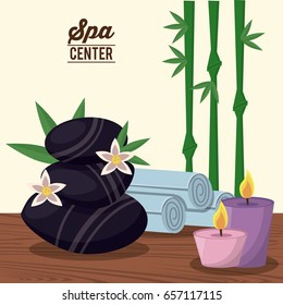 color poster of spa center with black stones and bamboo plant and candles and towels