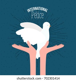 color poster with sparks and hands holding a pigeon with olive branch in peak and text international day of peace with linear brightness vector illustration