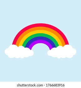 Color rainbow with clouds in the blue sky. Vector Illustration