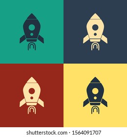 Color Rocket ship with fire icon isolated on color background. Space travel. Vintage style drawing. Vector Illustration