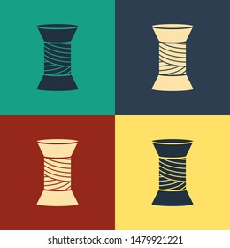 Color Sewing thread on spool icon isolated on color background. Yarn spool. Thread bobbin. Vintage style drawing. Vector Illustration