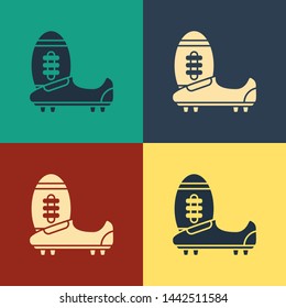 Color Soccer or football shoes with spikes icon isolated on color background. American football boot and ball. Vintage style drawing. Vector Illustration