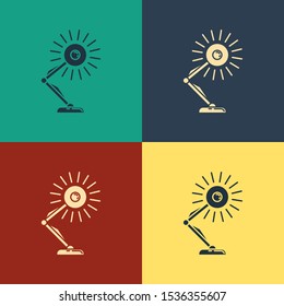 Color Table lamp icon isolated on color background. Table office lamp. Vintage style drawing. Vector Illustration