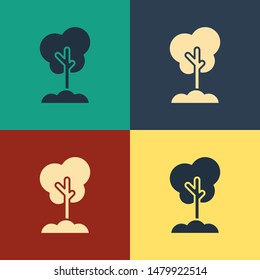 Color Tree in the ground icon isolated on color background. Forest symbol. Vintage style drawing. Vector Illustration