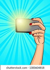 Color vector illustration of a female hand with a phone on a background of halftone. A girl makes a selfie. Design a poster about social networks and communicating with the phone.