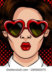 Color vector illustration in pop art style. The girl in sunglasses in the shape of a heart. The girl sends a kiss. Beautiful girl with brunette glasses with a style of 60-80s in a plastic frame