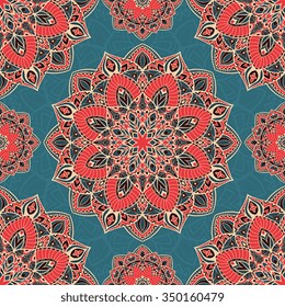 Color vector seamless pattern of mandalas. Abstract oriental ornament on a blue background. Template for design shawls, carpets, bedspreads.