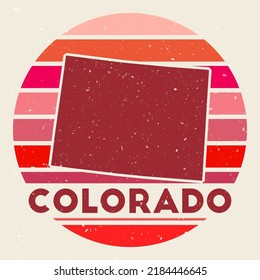 Colorado logo. Sign with the map of the US state and colored stripes, vector illustration. Can be used as insignia, logotype, label, sticker, or badge of Colorado.