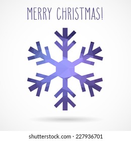 Colored abstract geometric snowflake with dropped shadow and handwritten Christmas greetings.