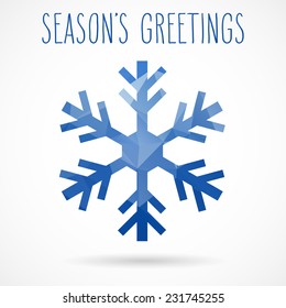 Colored abstract geometric snowflake with dropped shadow and handwritten season's greetings.