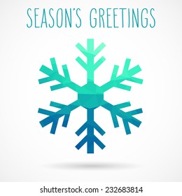 Colored abstract geometric snowflake with dropped shadow and handwritten season's greetings.