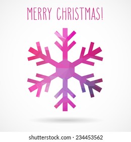 Colored abstract geometric snowflake with dropped shadow and handwritten Christmas greetings.