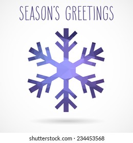 Colored abstract geometric snowflake with dropped shadow and handwritten season's greetings.