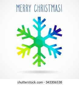 Colored abstract geometric snowflake with dropped shadow and handwritten Christmas greetings.