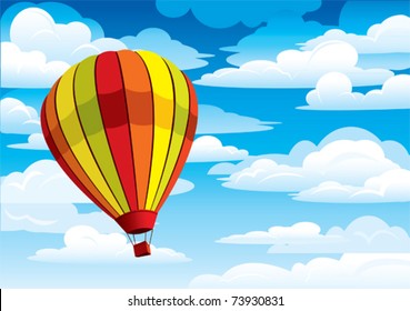 Colored balloon on a blue sky and white clouds