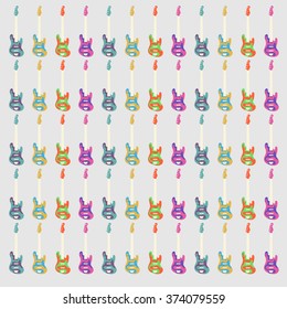 colored bass guitars on a gray background