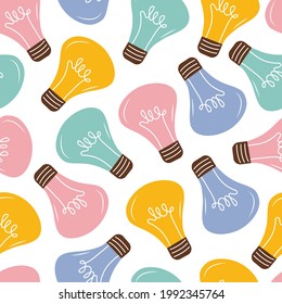Colored burning light bulbs seamless pattern. Background of bright shining light bulbs in pink, yellow, green and blue. Elements of energy, electricity and colored light. Vector flat illustration