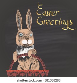  Colored chalk drawn illustration for Easter with rabbit in a wicker and golden text. Happy Easter theme. Card design. Holidays collection.